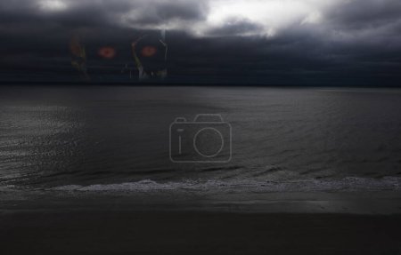 Photo for Dangerous storm approaching on the ocean with an evil spriit behind - Royalty Free Image