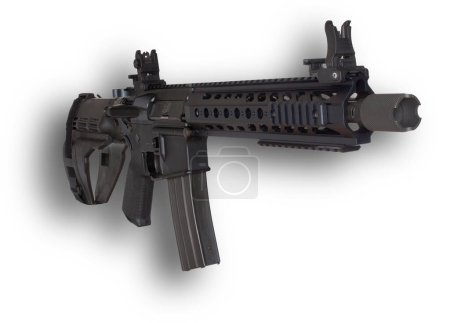 Photo for Shadow behind an AR-15 with a pistol brace and magazine inserted ready to fire - Royalty Free Image