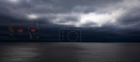 Photo for Dangerous skull in the clouds of a storm over the odean - Royalty Free Image