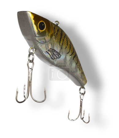 Drop shadow behind an artificial fishing bait that has yellow and brown color and two teble hooks.