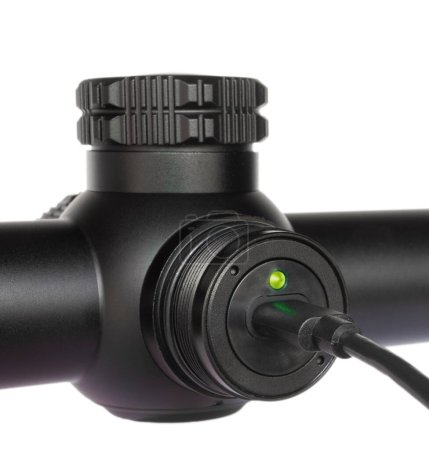 Infrared telescopic rifle sight used to shoot in the dark being recharged