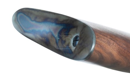 Buttplate that is color-casehardened on a wood stocked old west style lever action rifle isolated on white in a studio shot.