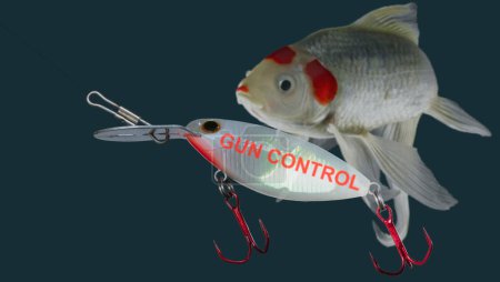Artificial fishing lure with gun conttrol in bright red letters looks tasty to the fish swimming up behind.