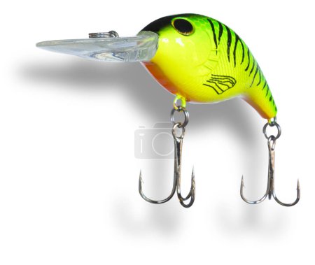 Artificial fishing lure that anglers cast for largemouth bass with two treble hooks with a shadow underneath.