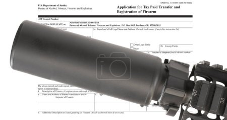 Assault rifle with a silencer above the public domain ATF form to own a suppressor 