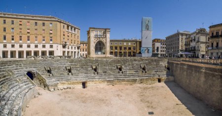 Photo for Lecce, Italy. 07 01 2019. Roman amphitheater of Lecce in the morning. Ruins of the amphitheater in the Sant' Oronzo square and the old church of San Marcos in the center of the photo. - Royalty Free Image