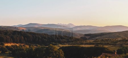 Photo for Sunset view of the northern Sierra de Gredos from Hoyos del Espino, Avila, Spain. Silhouette of the peaks of the formation of the circus of Gredos, the Almanzor peak stands out for its height. - Royalty Free Image