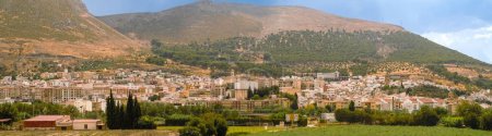 Panoramic view of Loja from the north. View of the city and in the background the Sierra Gorda crowned by storm clouds. Loja, Granada, Spain.