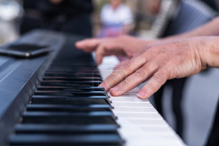 Photo for Man hands playing the piano - Royalty Free Image