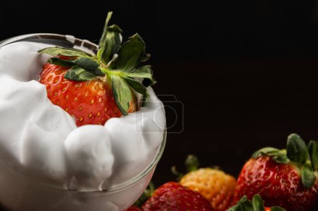 Photo for Plate of fresh red strawberries with whipped white chantilly cre - Royalty Free Image