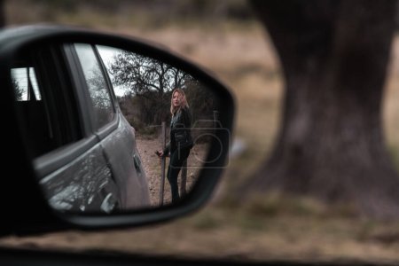 Photo for Reflections of Freedom: Distorted Mirror Captures Woman Opening - Royalty Free Image