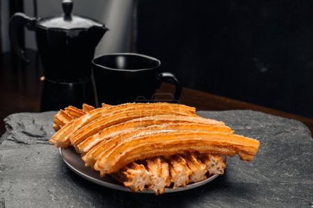 Photo for Crunchy Churros and Freshly Brewed Coffee: A Sweet Morning Delig - Royalty Free Image