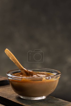 Photo for Closeup of a glass saucepan or bowls with delicious Argentine du - Royalty Free Image