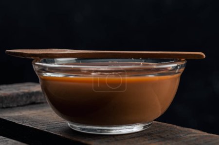 Photo for Closeup of a glass saucepan or bowls with delicious Argentine du - Royalty Free Image