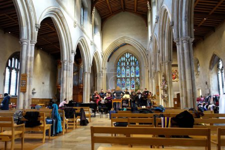 Photo for Interior of St Giles without Cripplegate, an Anglican church in the City of London, during choir practice - Royalty Free Image