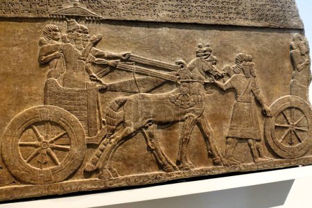 Photo for Alabaster wall panel in The British Museum depicting King Tiglath Pileser III (reign 745-727 BC) in his chariot - Royalty Free Image