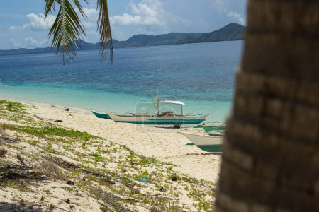 View of a typical Filipino beached bangka boat on the paradise island of the Philippines