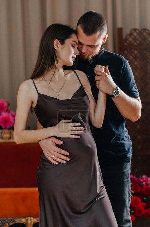 Photo for A pregnant woman is dancing with her husband - Royalty Free Image