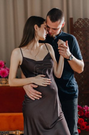 Photo for A pregnant woman is dancing with her husband - Royalty Free Image