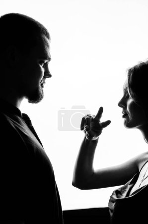 Photo for Couple looking at each other with white background. Black and white photo - Royalty Free Image