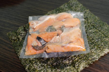 Photo for Cut from red fish with nori leaves - Royalty Free Image