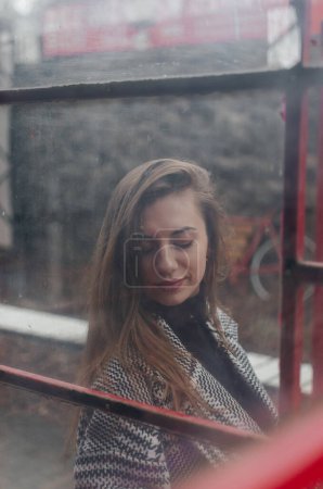 Photo for Portrait of a girl behind glass - Royalty Free Image
