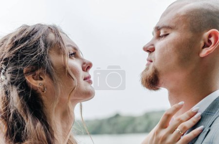 Photo for The bride and groom look at each other - Royalty Free Image