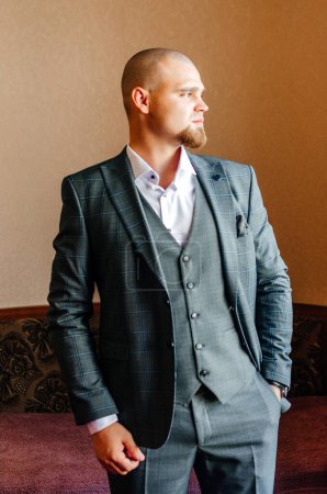 Photo for The groom in a suit looks away - Royalty Free Image