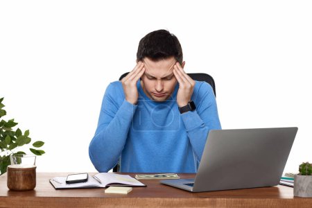 Photo for Sad man have a headache, using laptop in office - Royalty Free Image