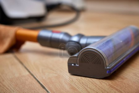Photo for Close-up of cordless vacuum cleaner on the floor. - Royalty Free Image