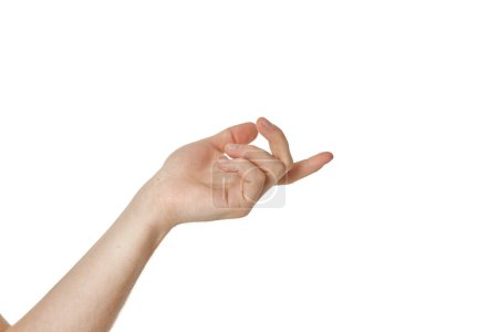 Photo for Male hand reaches for something on white studio background. - Royalty Free Image