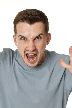 Photo for Annoyed angry bearded man shouting on white studio background - Royalty Free Image