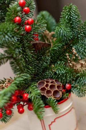 Photo for Homemade christmas decorations on table. Christmas bouquet in vase - Royalty Free Image