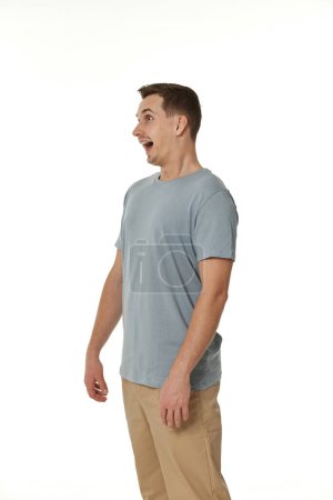 Photo for Surprised guy looking at camera on white studio background - Royalty Free Image
