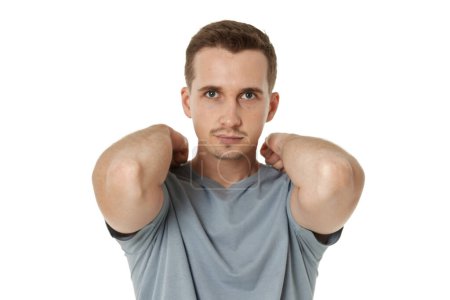 Photo for Young man having two arms behind the head - Royalty Free Image