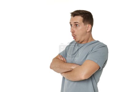 Photo for Surprised guy looking at camera on white studio background - Royalty Free Image