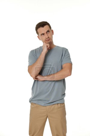 Photo for Young confused puzzled man isolated on white background - Royalty Free Image