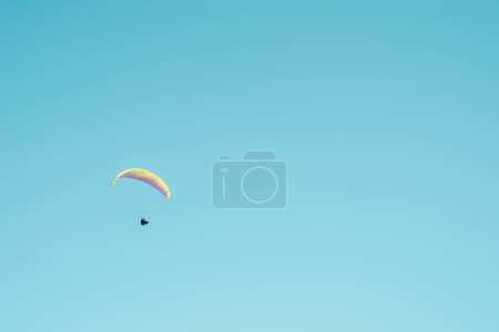 Photo for A person flying with a parasail - Royalty Free Image