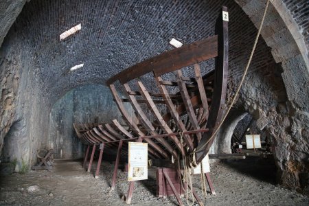 Photo for ANTALYA, TURKIYE - JULY 21, 2022: Ship in historic shipyard of Alanya Town. Shipyard was built in 1229 - Royalty Free Image