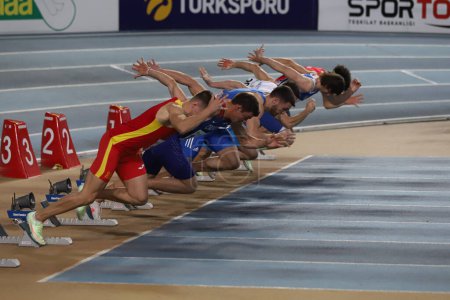Photo for ISTANBUL, TURKEY - MARCH 05, 2022: Athletes running 60 metres during Balkan Athletics Indoor Championships in Atakoy Athletics Arena - Royalty Free Image