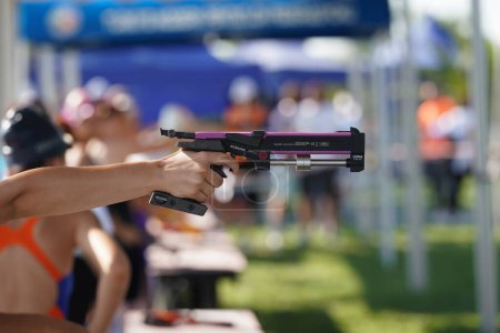 Photo for ISTANBUL, TURKIYE - JULY 02, 2022: Undefined athlete competing in laser pistol shooting component of modern pentathlon during Maltepe Water Sports Festival - Royalty Free Image