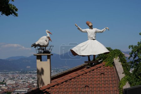 Stork and whirling dervish statue in Bursa City, Turkiye