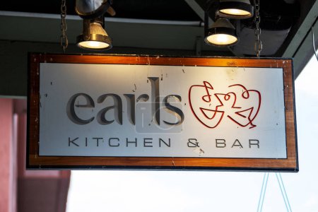 Photo for BANFF, CANADA - JULY 5, 2023 : Earls Kitchen and Bar on busy Banff Avenue in Alberta, Canada. They are a Canadian-based premium casual dining chain that operates a total of 68 restaurants in Canada and the United States. Their head office is in Vanco - Royalty Free Image