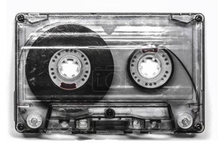 Foto de Old vintage audio cassette with transparent body, isolated on white background - Imagen libre de derechos