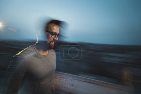 Photo for Blured motion, long exposure image of an athletic man walking - Royalty Free Image