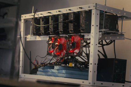 Photo for Mining rig for cryptocurrency digging set up and operational. Selective focus - Royalty Free Image