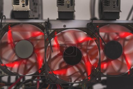 Photo for Detail of a mining rig for cryptocurrency digging set up and operational. Selective focus - Royalty Free Image