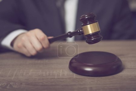 Photo for Detail of a judge in a courtroom making a verdict. Selective focus - Royalty Free Image