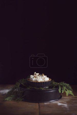 Photo for Apple tart decorated with whipped cream and cinnamon. Selective focus - Royalty Free Image