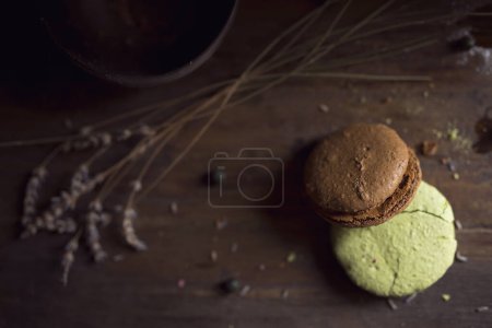 Photo for Top view of a macaron cookies, cherry fruit and lavender flowers on the table. Selective focus - Royalty Free Image